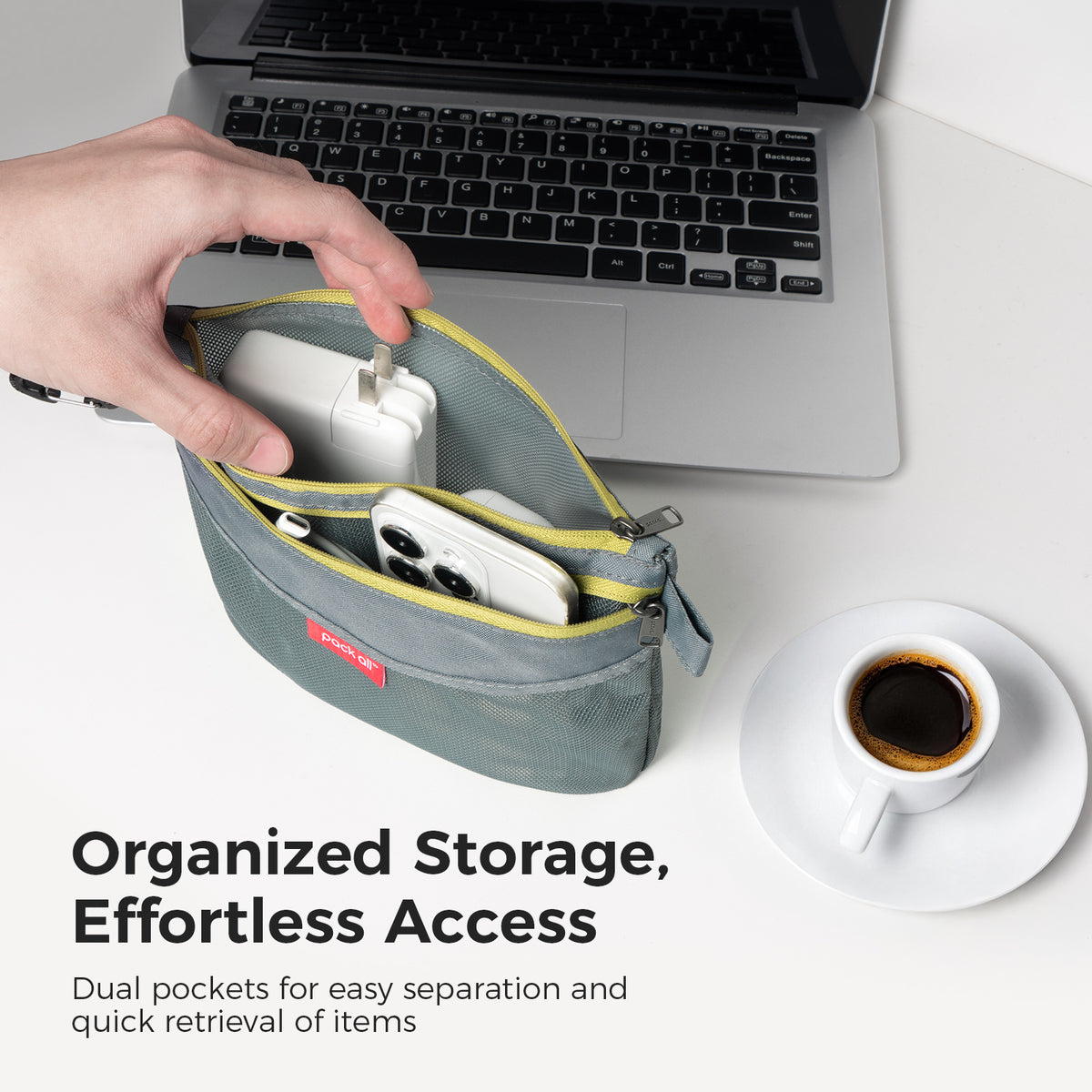 The pack all® gray medium double-layer daily pouch open on a desk with a phone, charging accessories and small items organized in two sections.